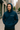 Man wearing a Hopscotchfit moisture-wicking hoodie in urban setting, showcasing style and comfort.